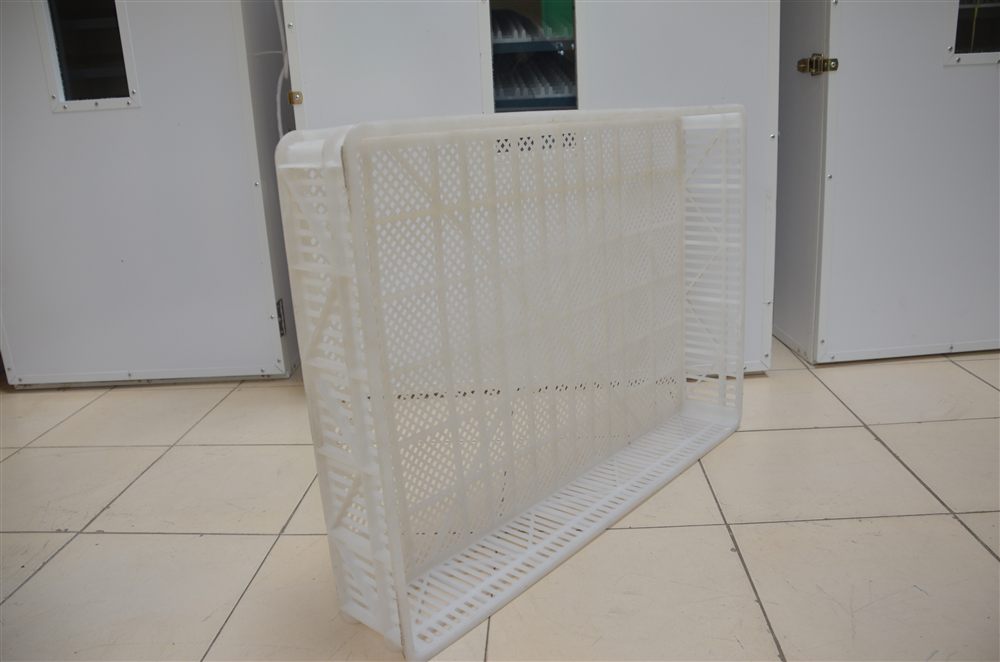 White ventilated plastic hatching basket with a lattice pattern