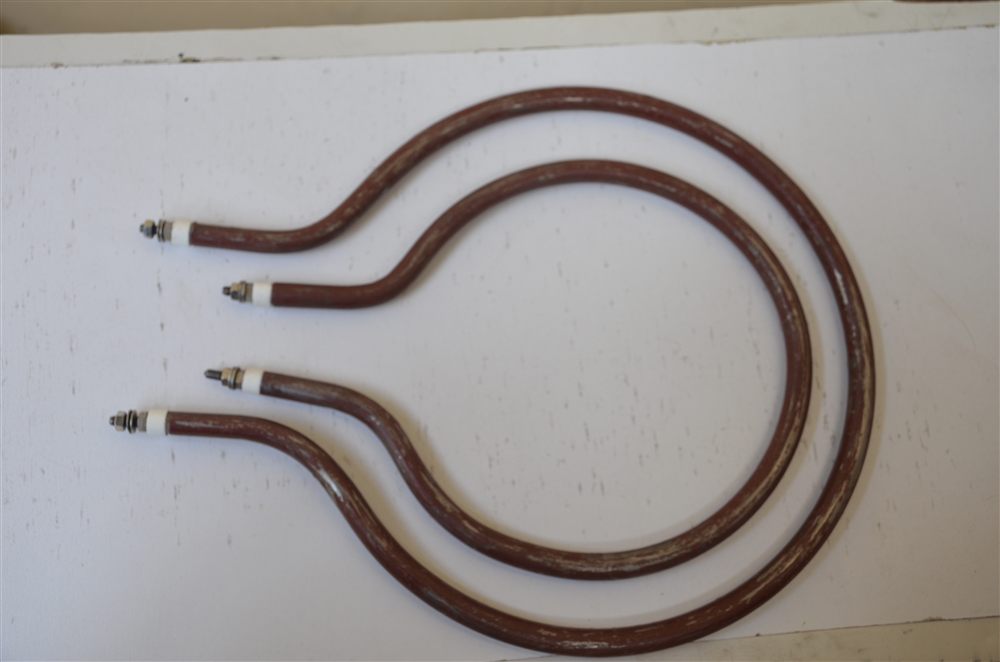 Two ring-shaped brown heating tubes of different sizes with ceramic ends and threaded terminals