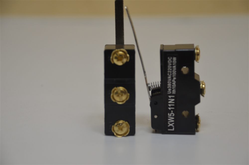Two black LXW5-11N1 limit switches with brass screw terminals and a lever arm